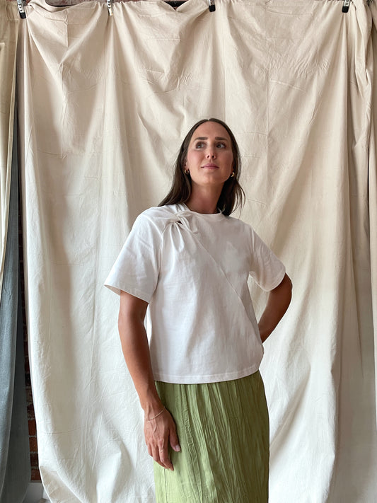 Elevated white t-shirt with twist detail at neckline 